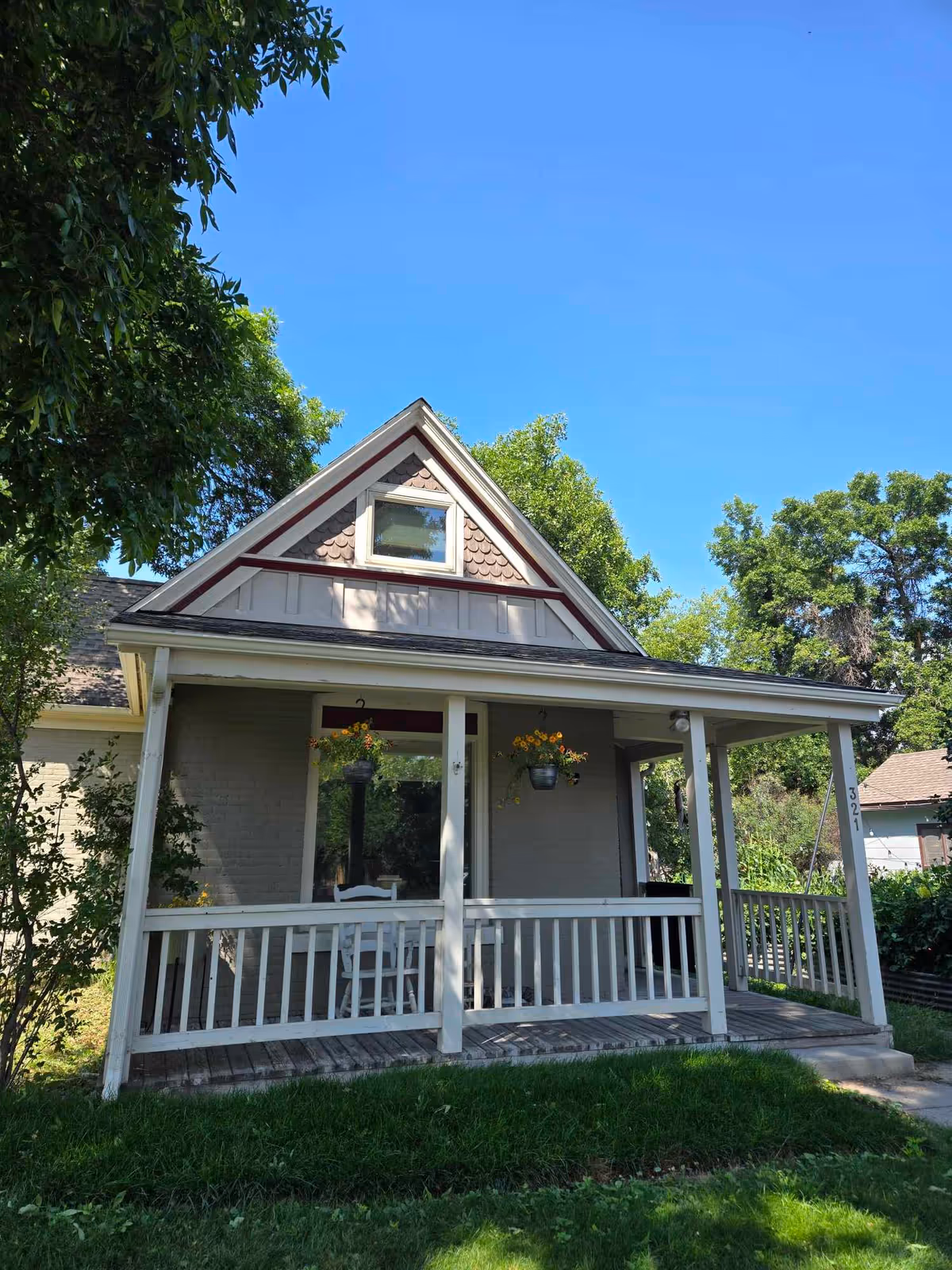 Front view of a house-style senior care facility with a covered porch.