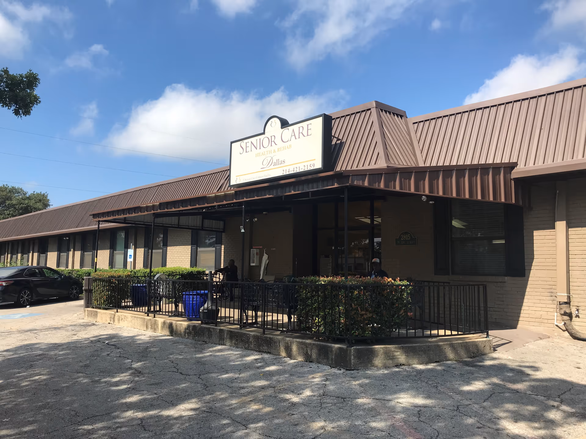 Exterior of a single-story senior care facility with a front entrance.