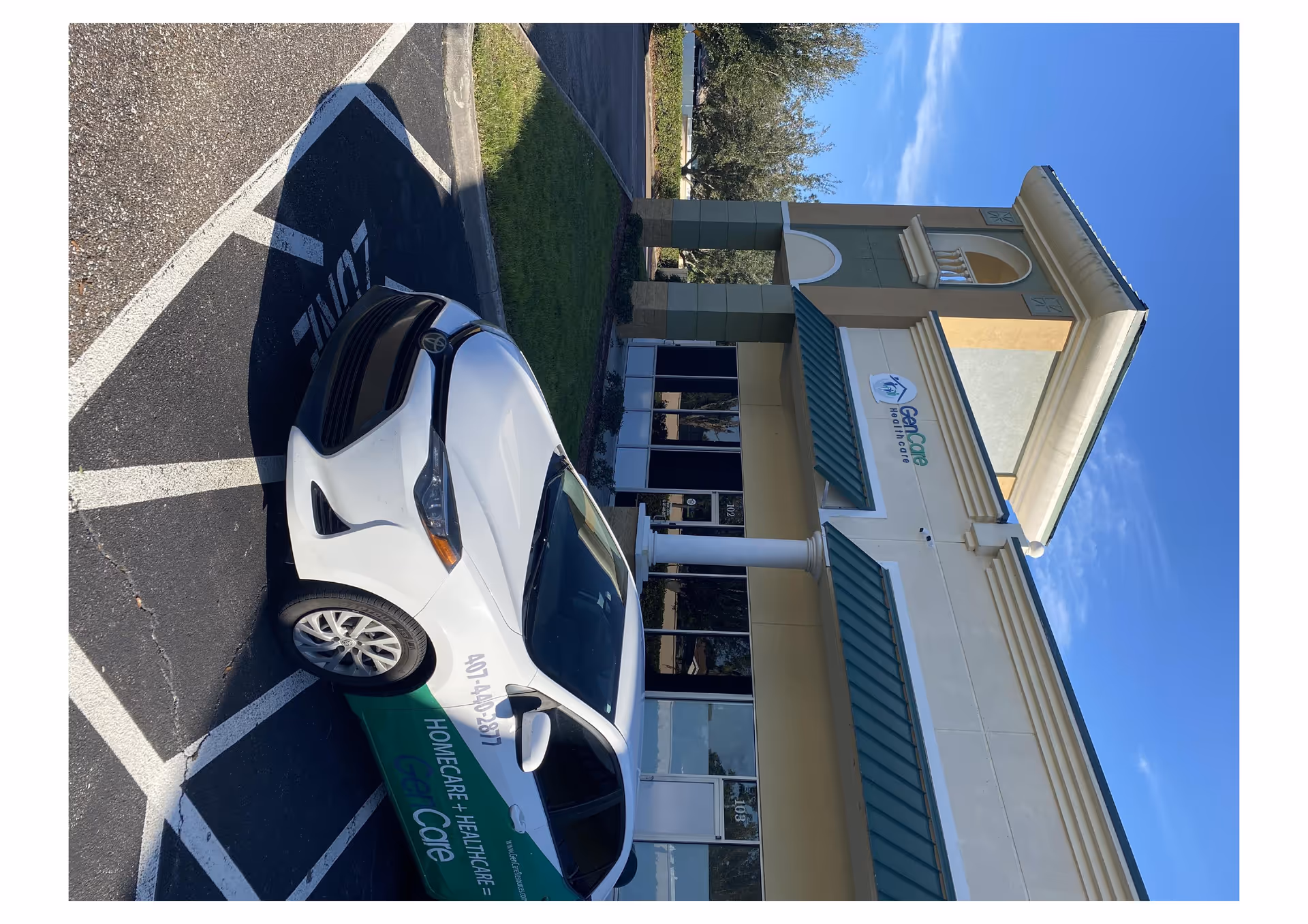GenCare Resources building front with a white car parked in a handicapped space.