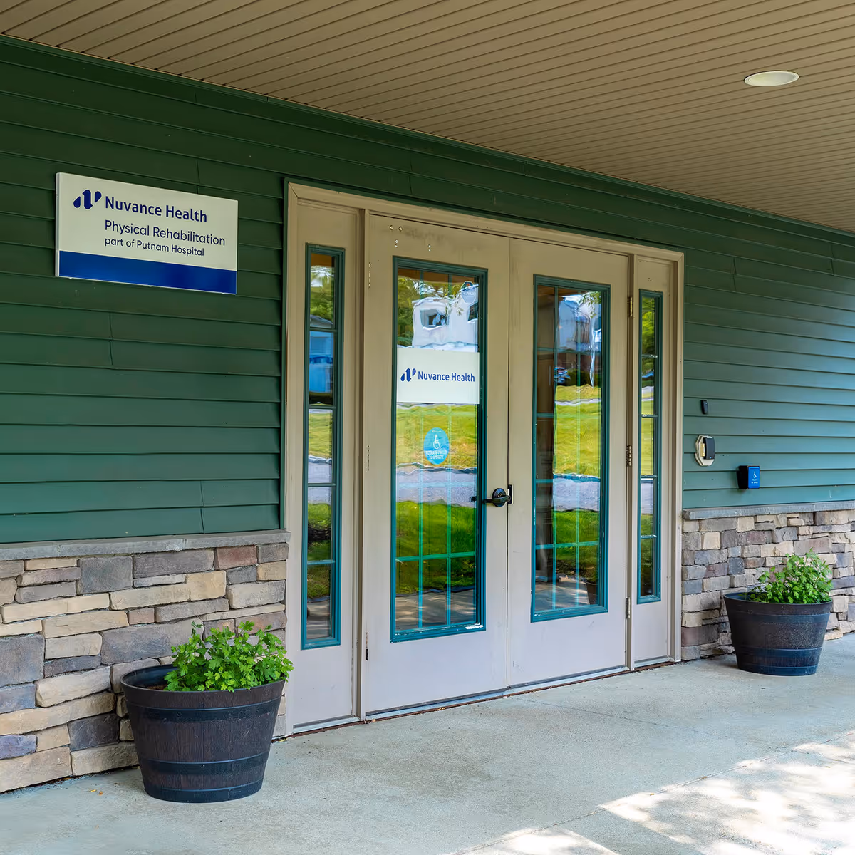 Green exterior with double glass doors and Nuvance Health Physical Rehabilitation at Pawling sign.