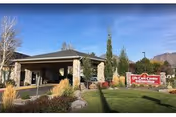 Front exterior of Life Care Center of Salt Lake City with stone entrance and sign.