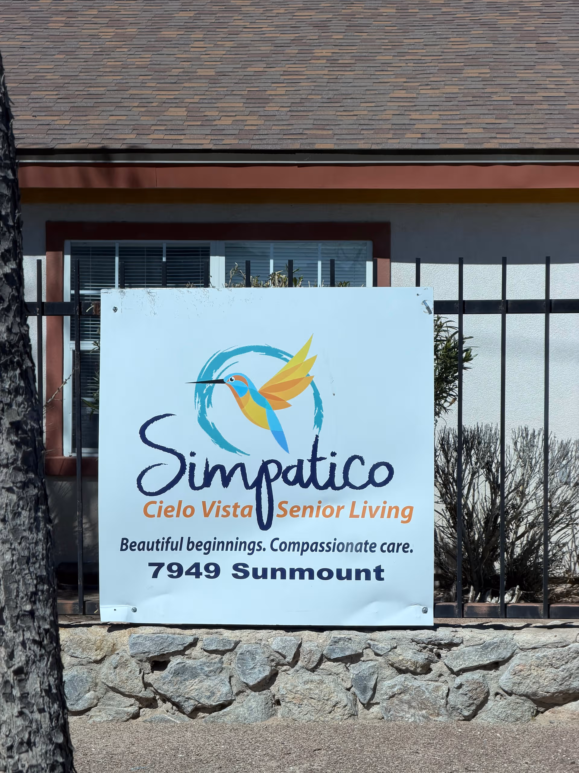 Exterior signboard for Simpatico Cielo Vista Senior Living in front of a building.