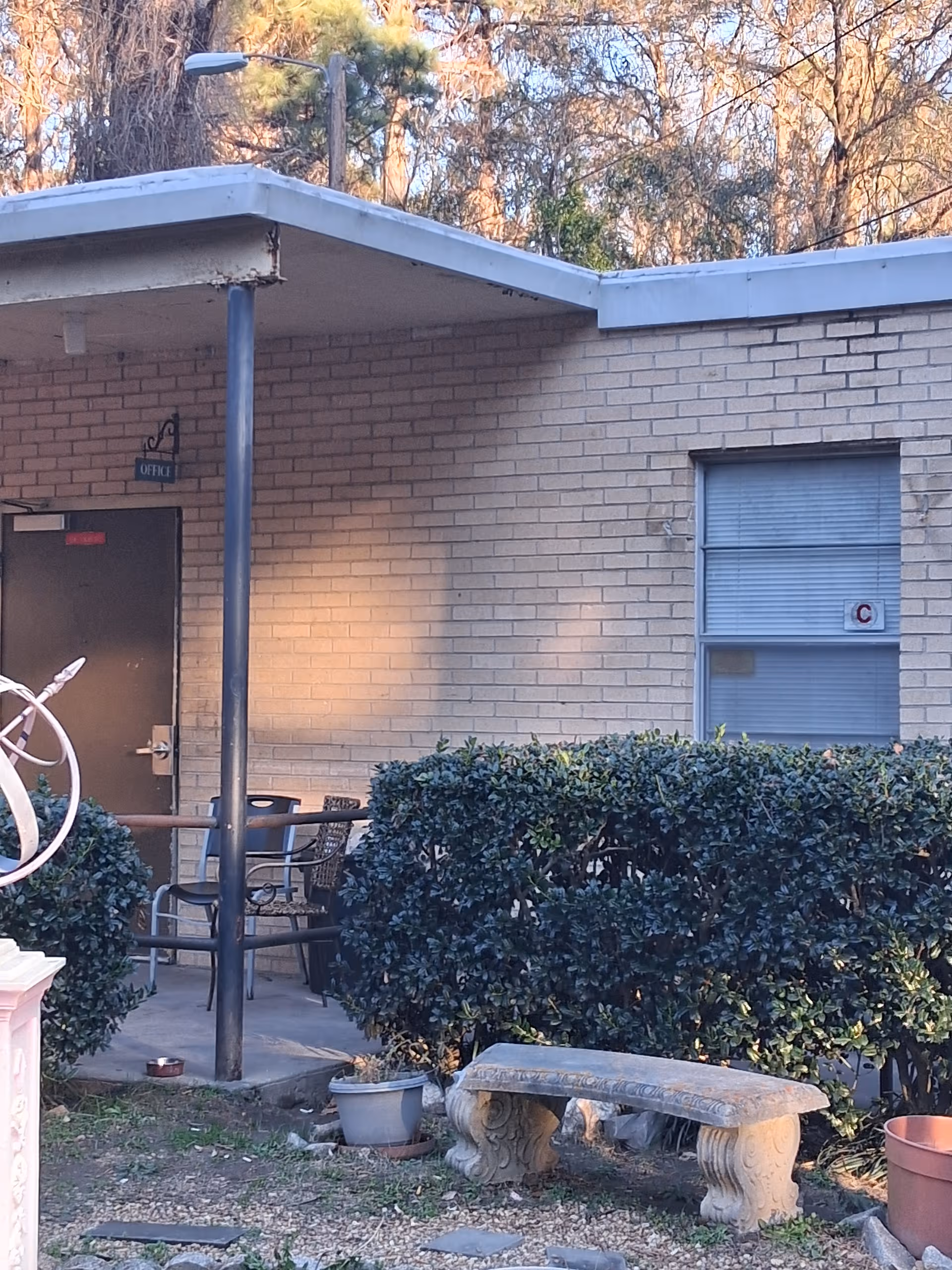 Exterior view of Westside Residential Home Inc with patio seating.