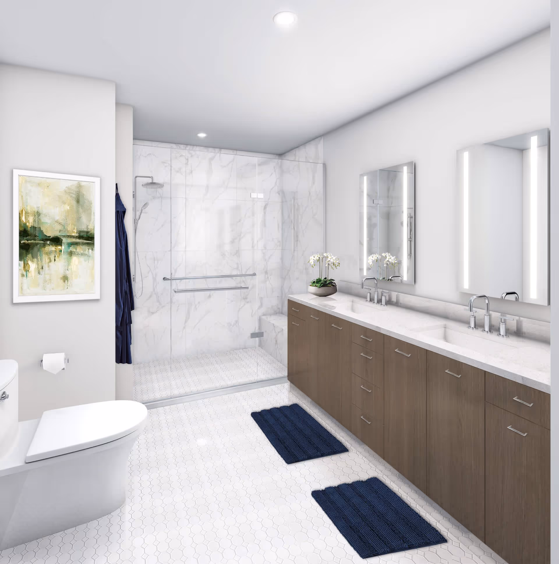 A modern bathroom with a white toilet, a large double sink vanity with wooden cabinets, two illuminated mirrors, a glass-enclosed shower with marble walls, two navy blue bath mats on the white hexagonal tiled floor, and a framed abstract painting on the wall.