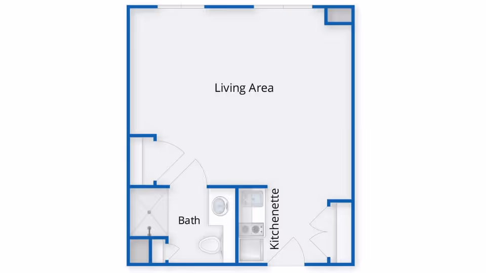 Floor plan of a living space at Evans Park at Newton Corner showing a living area, a bath with a shower and toilet, and a kitchenette.