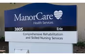 Outdoor sign for ManorCare Health Services located at 3805 Erie, offering comprehensive rehabilitation and skilled nursing services.