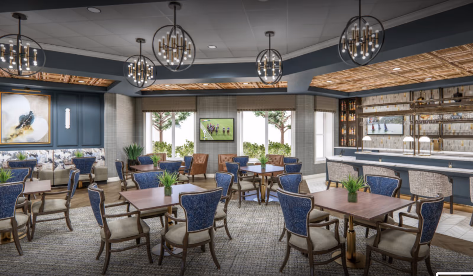 A stylish dining room with several wooden tables and blue upholstered chairs arranged neatly. The room features modern spherical chandeliers hanging from the ceiling, a bar area with high stools, and large windows letting in natural light. There are decorative plants on the tables and artwork on the walls, creating a welcoming atmosphere.