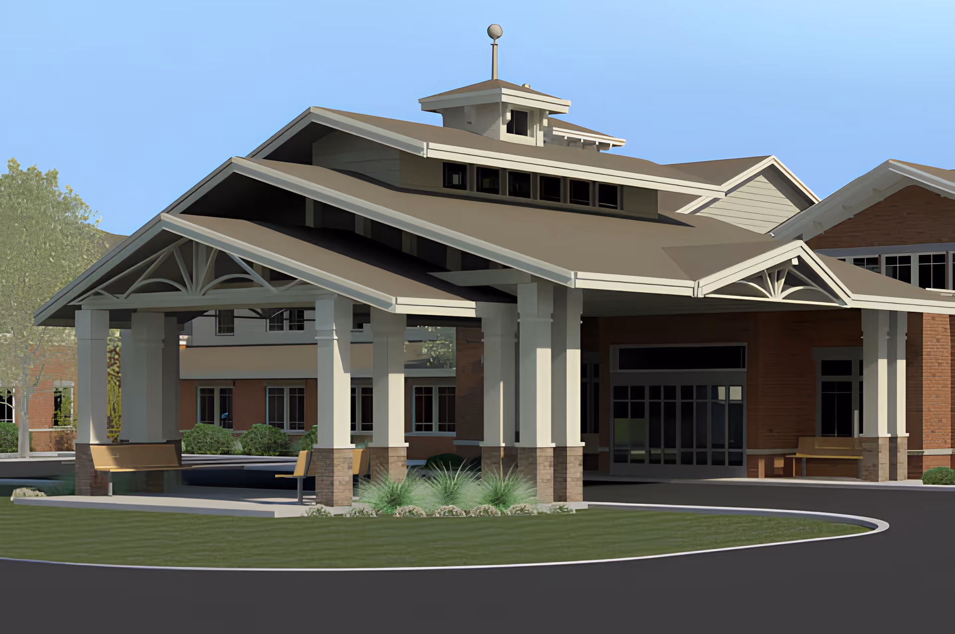 Exterior view of the entrance to a senior living facility named Park Village Southside, featuring a covered drop-off area with large white pillars, benches, and a circular driveway surrounded by green landscaping.