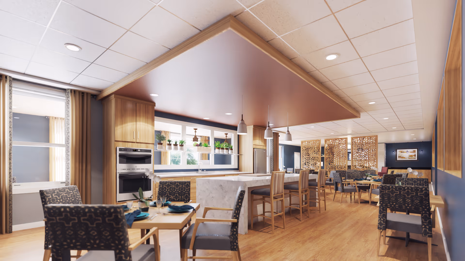 A spacious and modern dining area with wooden floors and furniture. The room features a large kitchen island with bar stools, pendant lighting, and built-in ovens. Several tables with patterned chairs are arranged for dining, and decorative wooden partitions separate the space. Large windows with potted plants on the sill allow natural light to fill the room.