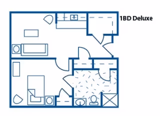 Floor plan layout of a 1-bedroom deluxe apartment showing a living area with a couch and table, a kitchen area, a bedroom with a bed and nightstand, and a bathroom with a sink, toilet, and shower.