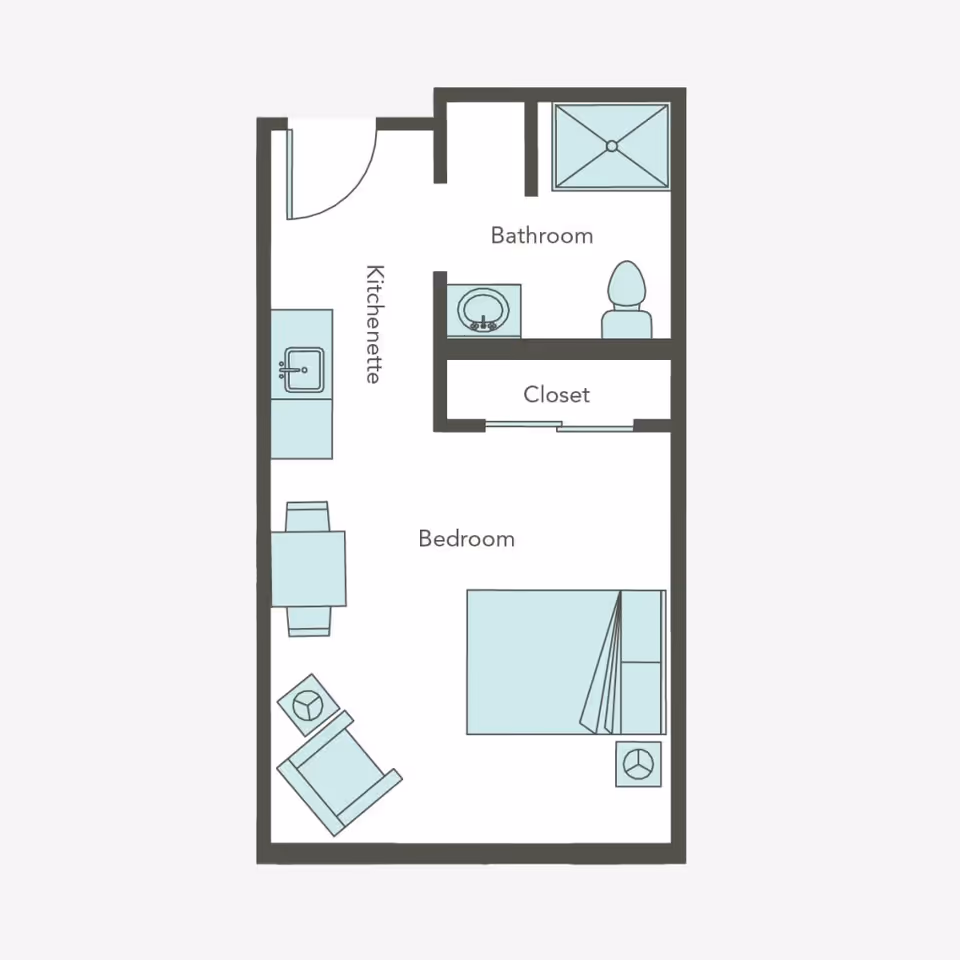 Floor plan of a small living space at Aegis Living Marymoor showing a bedroom with a bed, chair, and side tables, a kitchenette with a sink and dining table, a bathroom with a shower, toilet, and sink, and a closet.
