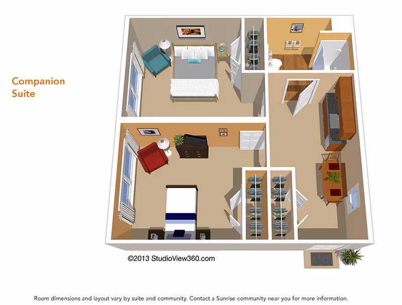 3D floor plan of a companion suite showing two bedrooms, each with a bed, chair, and nightstand. The suite includes a shared bathroom with a shower, a kitchen area with cabinets and a dining table, and closets. The layout is labeled 'Companion Suite'.