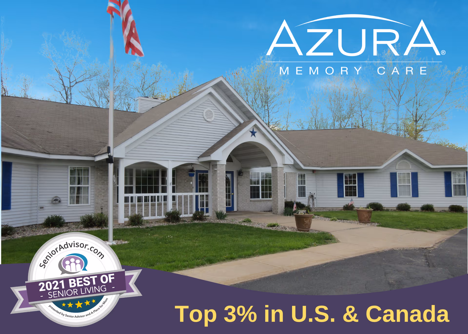 Exterior view of Azura Memory Care of Wausau, a single-story building with white siding, blue shutters, and a covered entrance with columns. An American flag is flying on a flagpole in front of the building, and there is a paved walkway leading to the entrance. The sky is clear and blue.