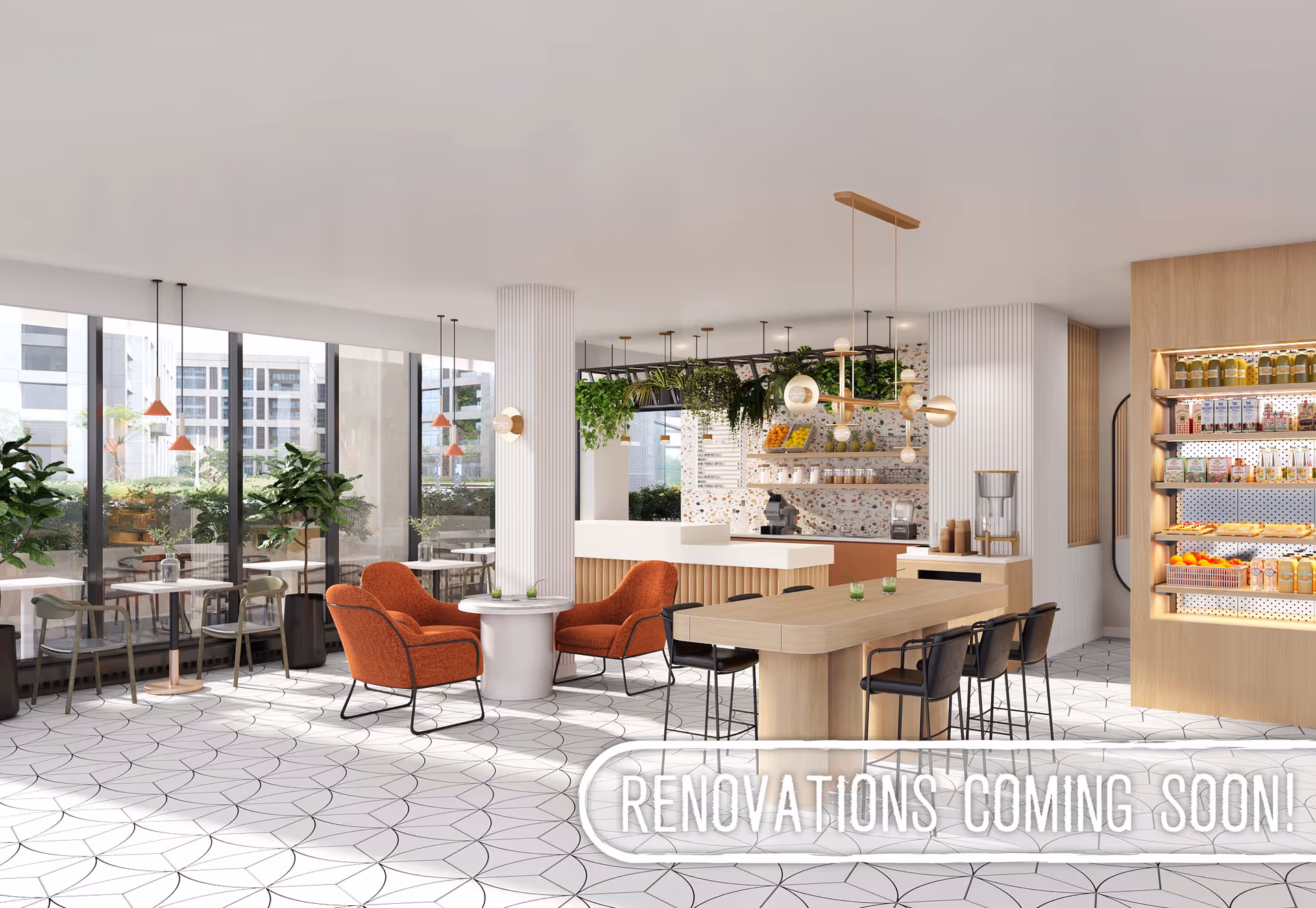 A modern and bright common area with large floor-to-ceiling windows, orange armchairs around a small round table, a long wooden table with black chairs, hanging plants, pendant lights, and a display shelf stocked with various food and drink items. The floor has a white tile pattern, and there is a sign that reads 'RENOVATIONS COMING SOON!'