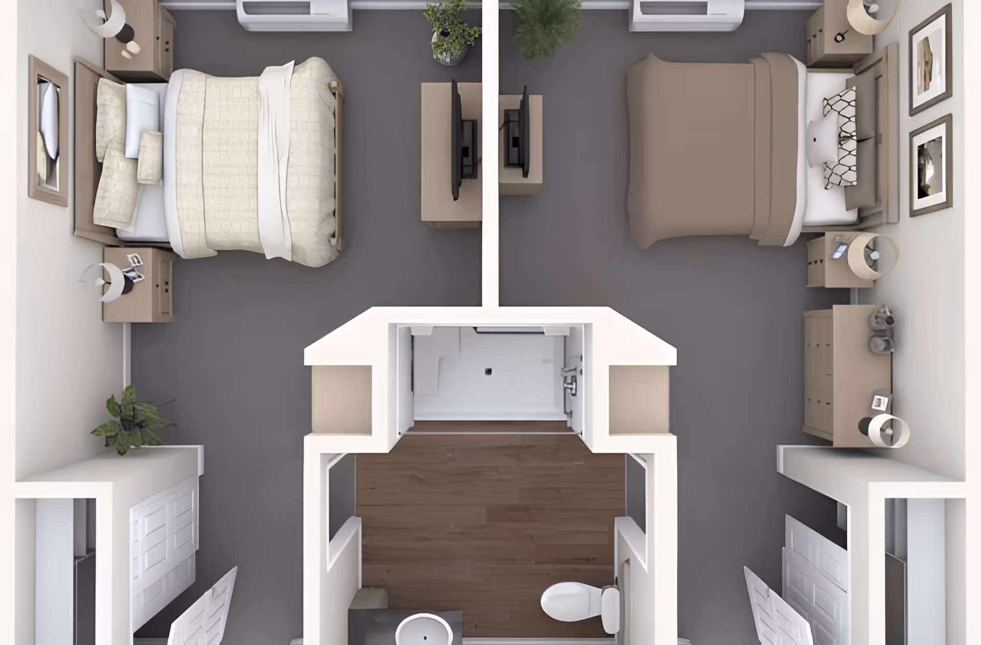 Top-down view of a floor plan showing two bedrooms separated by a wall with TVs facing each bed. Each bedroom has a bed, nightstands, lamps, and dressers. Between the bedrooms is a bathroom with a toilet, sink, and shower. The floor in the bathroom is wood, while the bedrooms have carpeted floors.