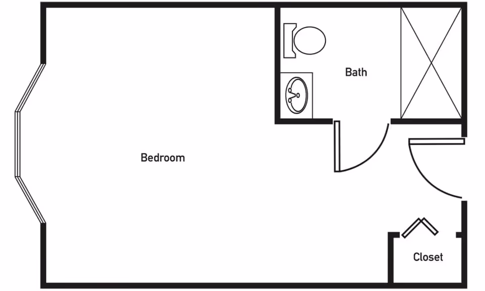 Floor plan layout showing a bedroom with a bay window, an attached bathroom with a toilet, sink, and shower, and a closet near the entrance.