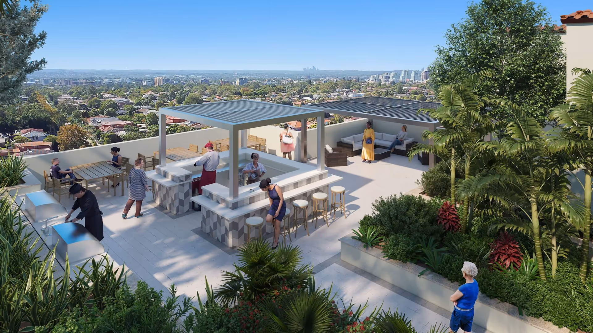 A rooftop outdoor patio area with seating, a bar with stools, and people socializing. The space is surrounded by greenery and plants, with a clear view of a cityscape in the distance under a blue sky.